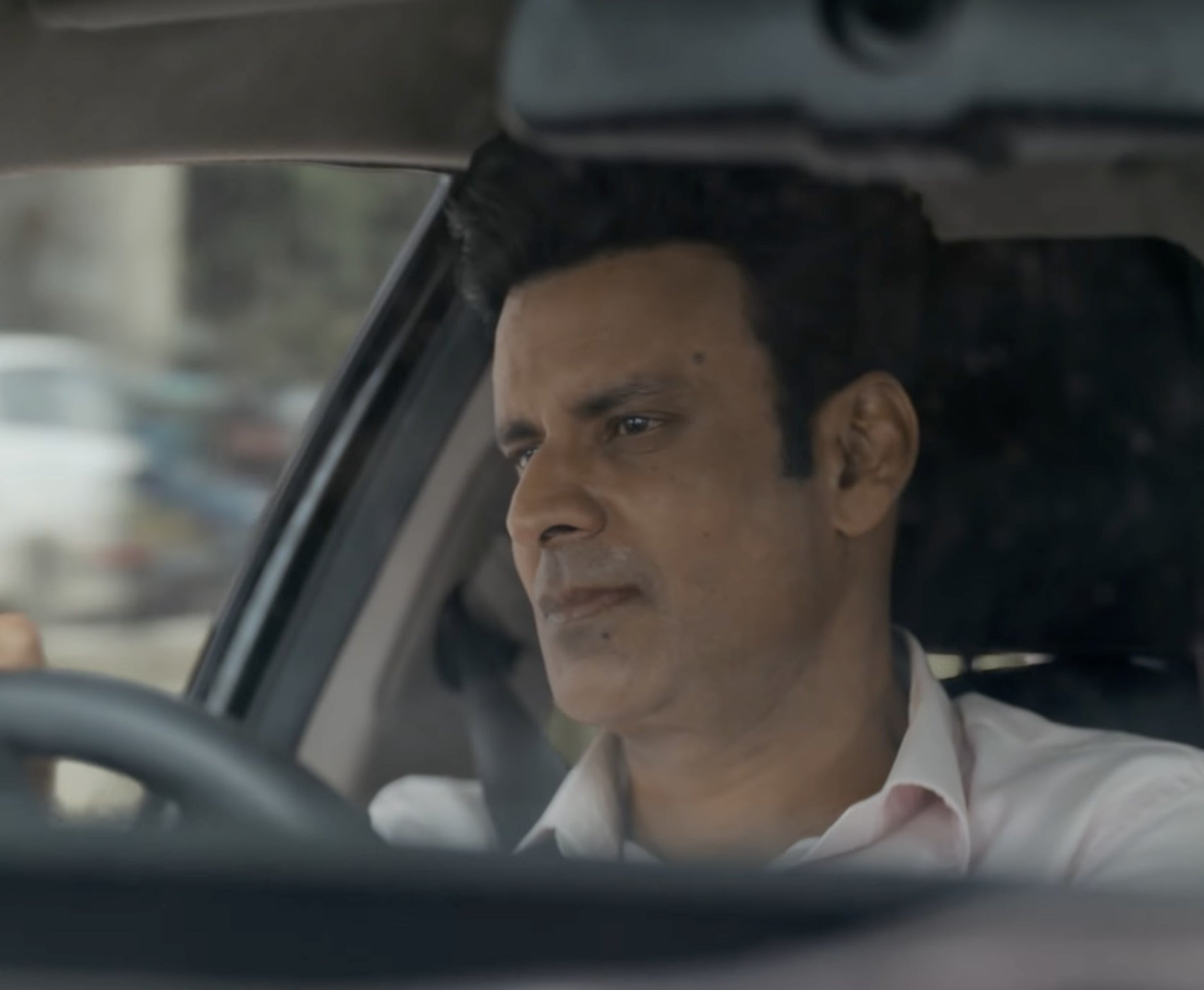 Manoj Bajpayee driving a car