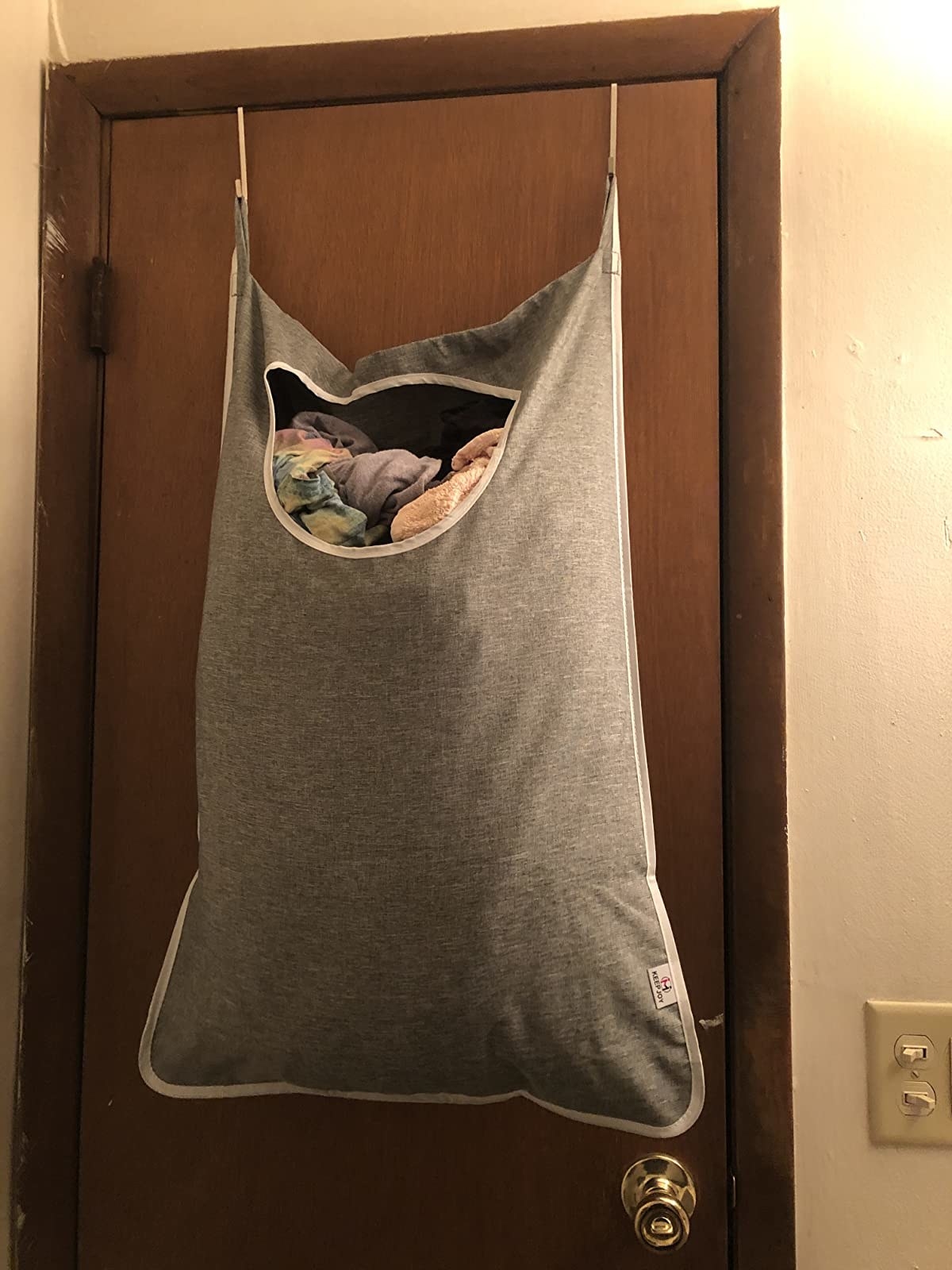 a hanging laundry bag on a door