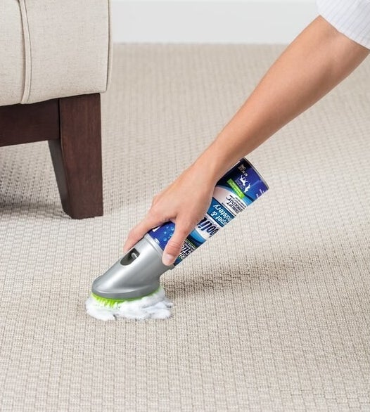 A model using foaming carpet and upholstery cleaner