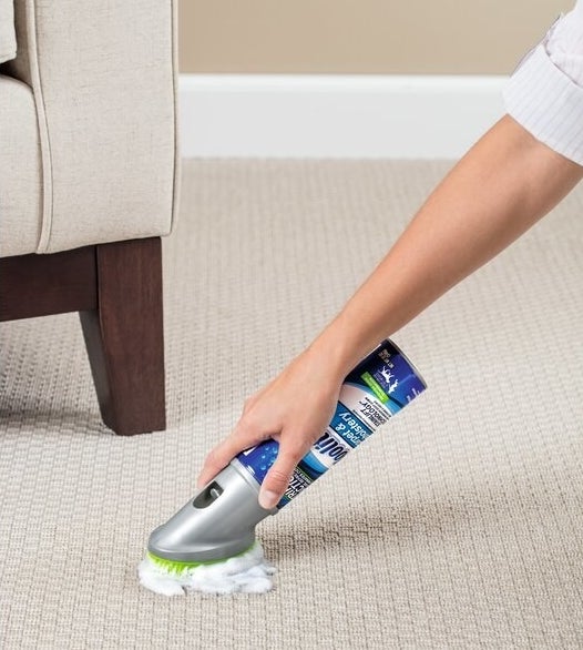 A model using foaming carpet and upholstery cleaner