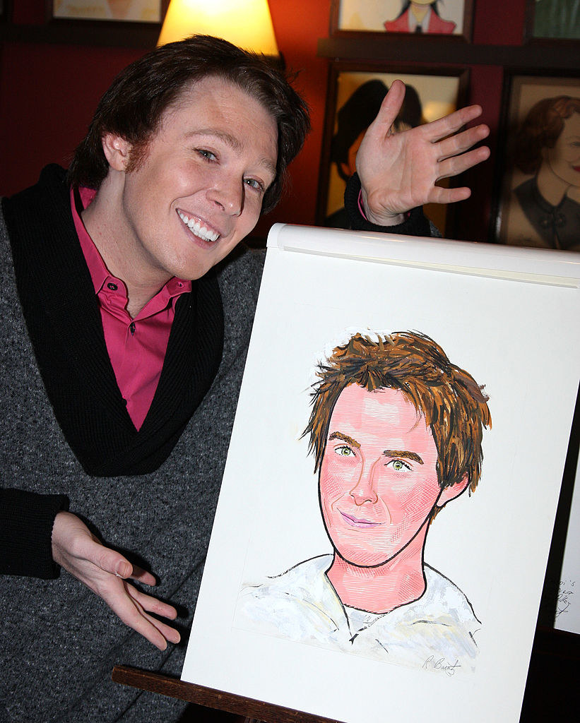Clay Aiken next to a drawing of himself