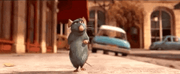 The rat from &quot;Ratatouille&quot; running on the street.