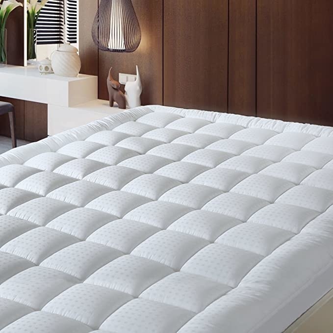 the mattress cover on a bed in a bedroom