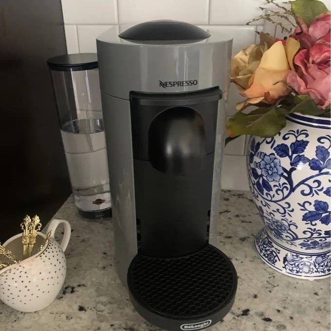 A user review image of the coffee machine in gray