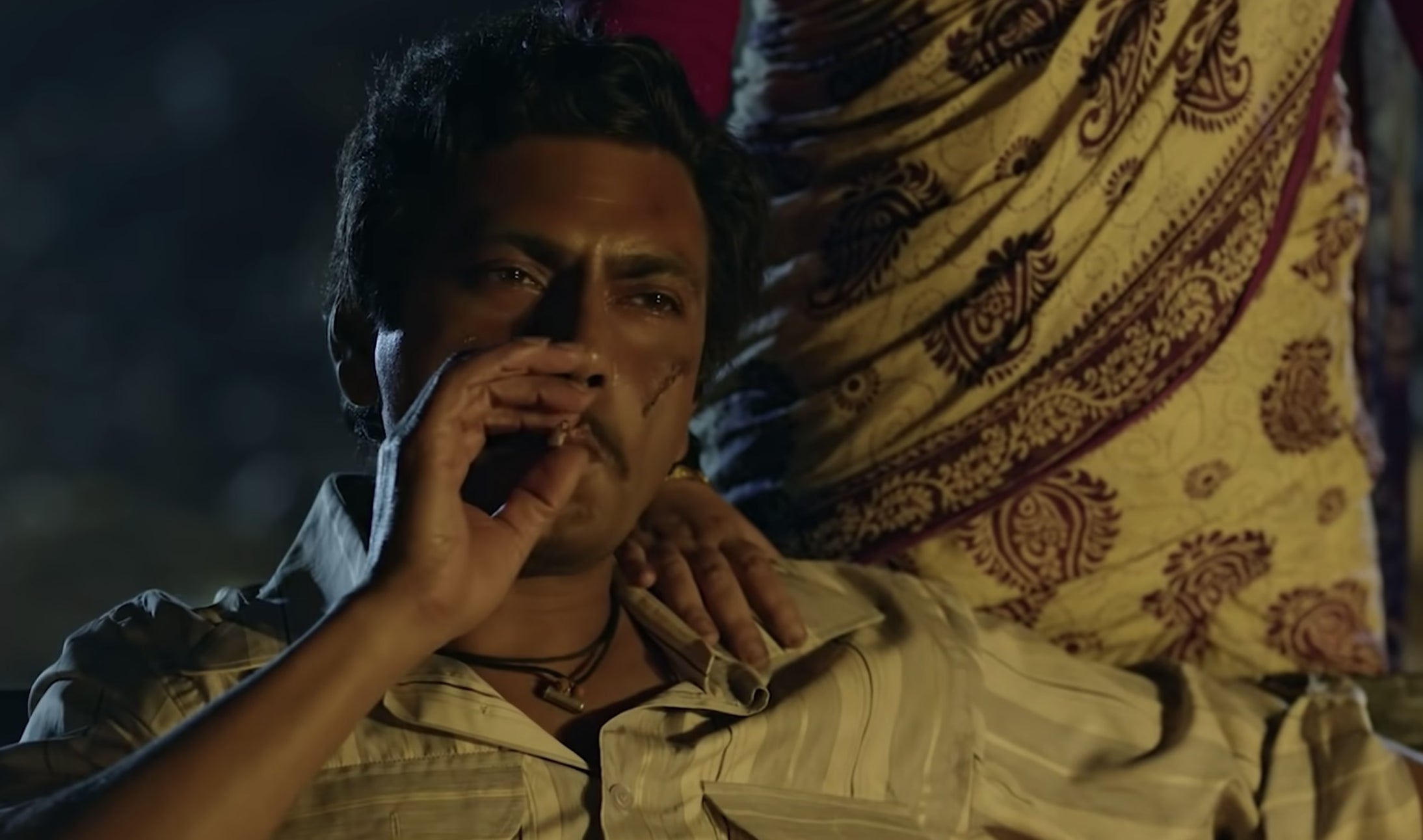 Nawazuddin Siddiqui smoking a cigarette in a still from Sacred Games