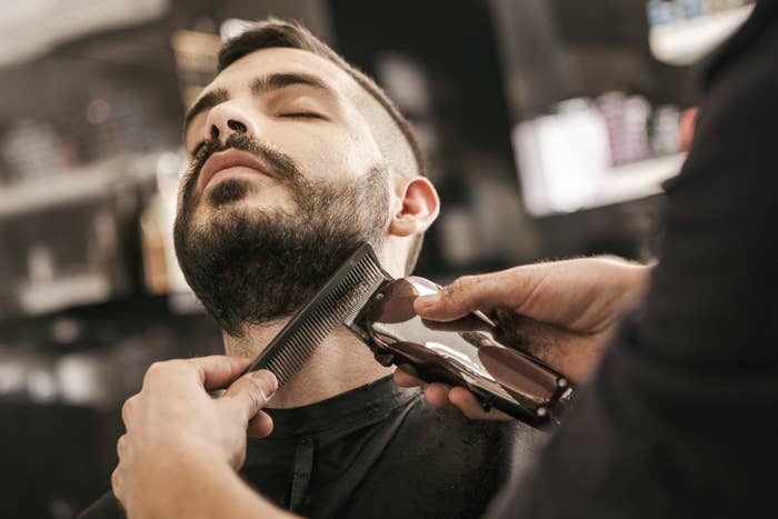Man getting his beard trimmed