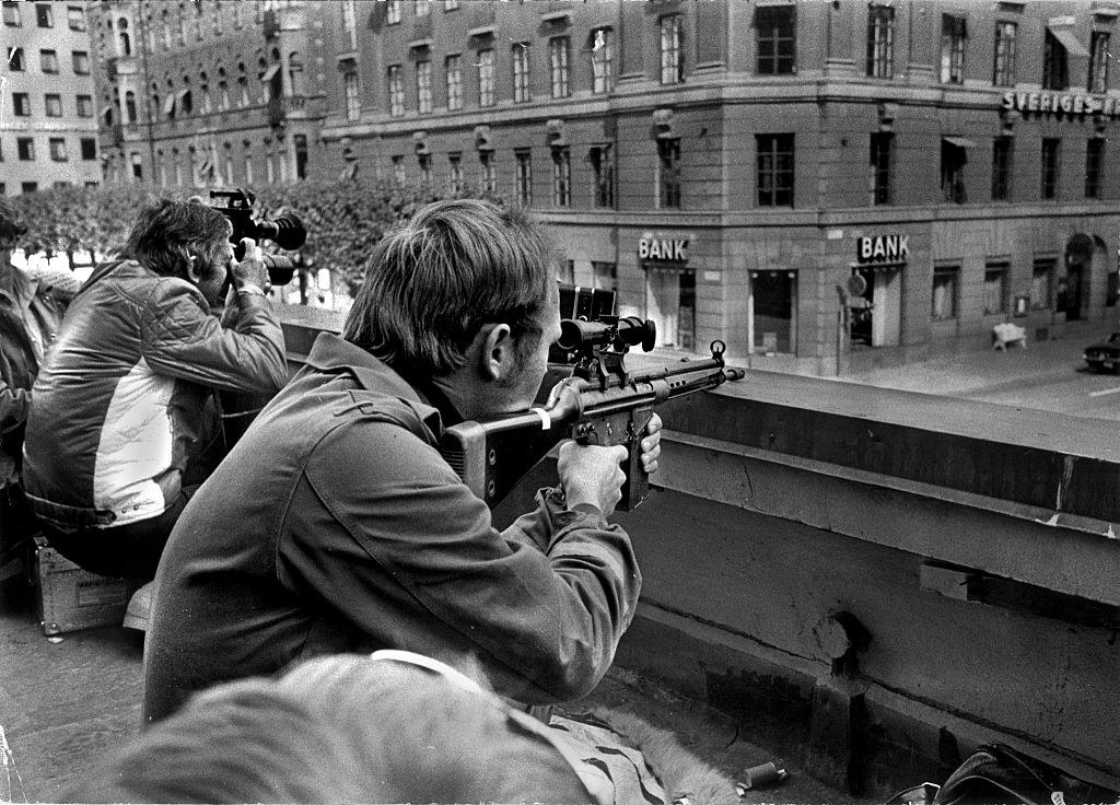 Snipers sit on the roof across from Kreditbanken bank