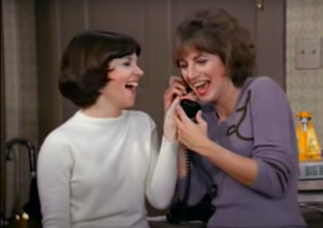 laverne and shirley laughing into a phone