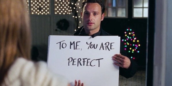 Andrew Lincoln as Mark in &quot;Love Actually&quot; holding up a sign that reads &quot;to me you are perfect&quot;