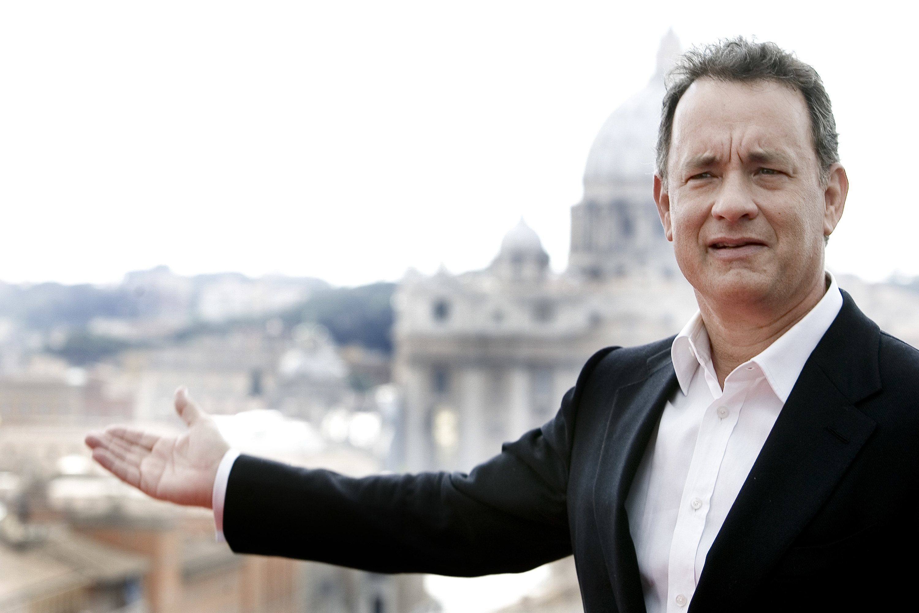 Tom gestures to the city of Rome behind him