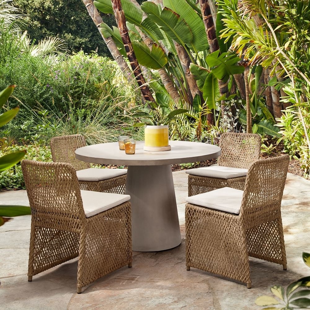 an outdoor dining table and chairs set