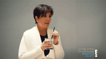 Kris Jenner stirring a drink
