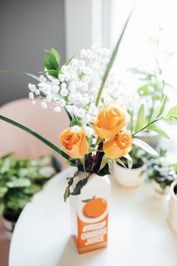 a reviewer photo of the vase filled with flowers on a table