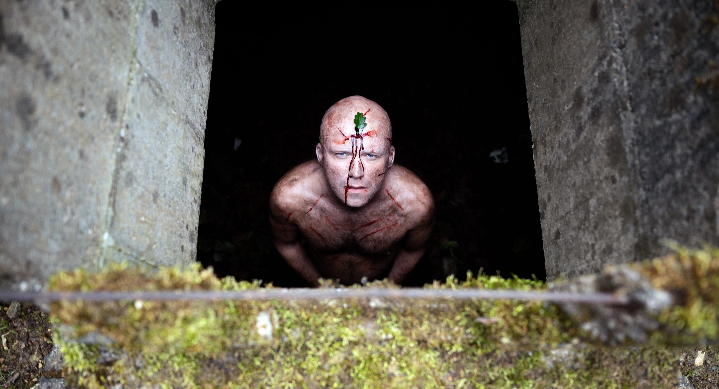 Rory Kinnear stands in a pit