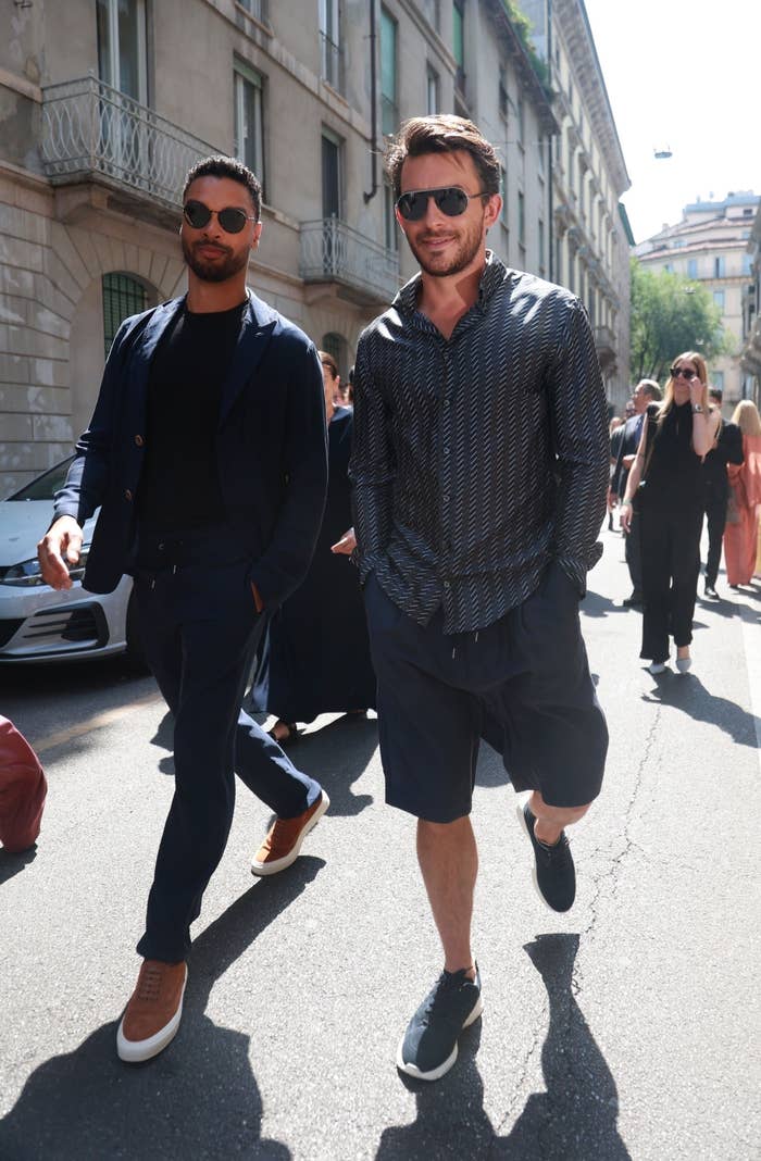 Regé-Jean and Jonathan walk down the street together in Italy
