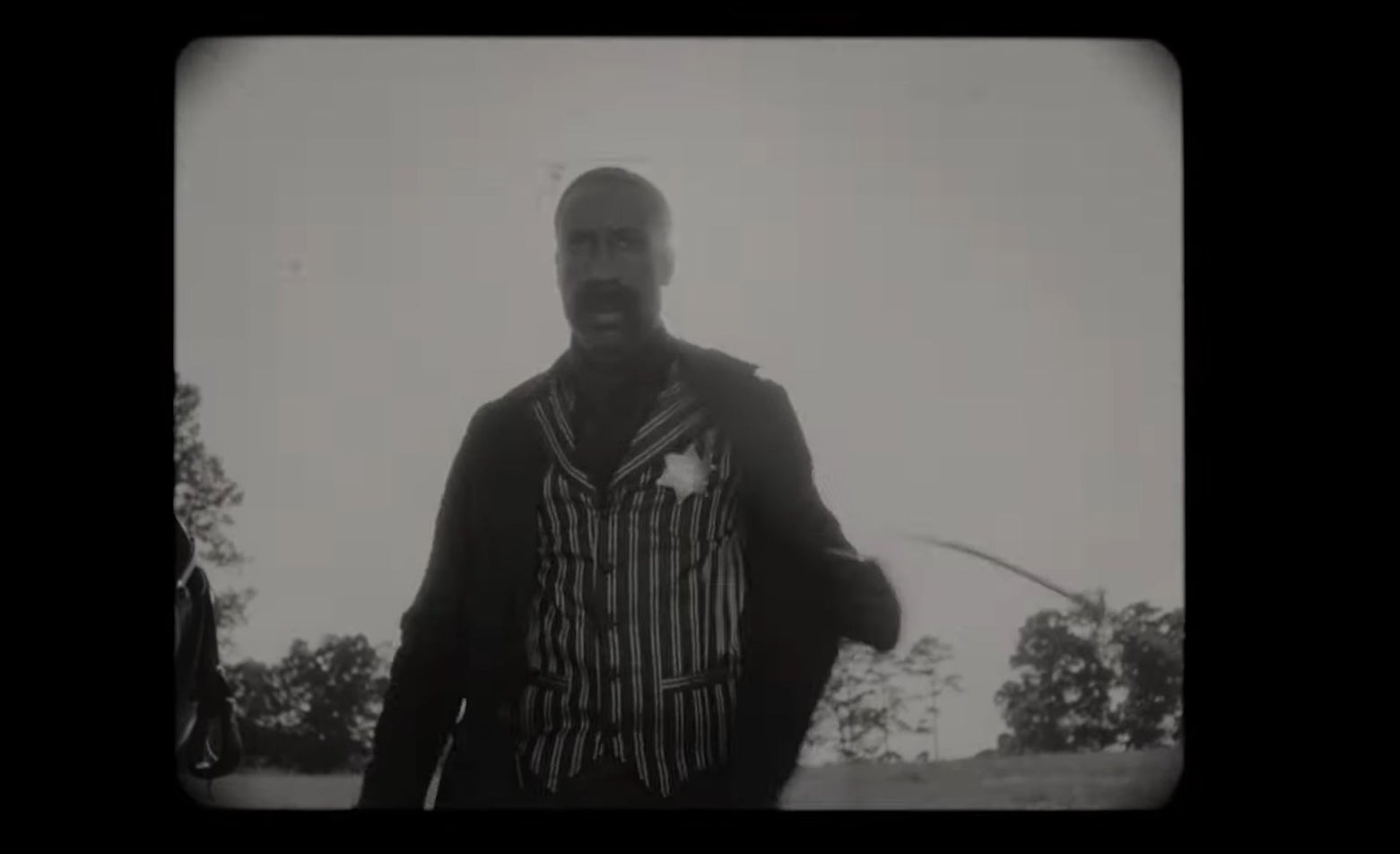 Bass Reeves in a black and white film in &quot;Watchmen&quot; (2019)