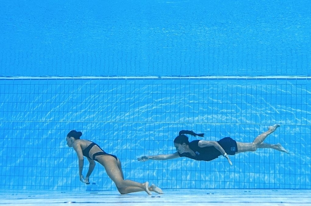 A Champion Swimmer Fainted While Competing Underwater. Her Coach Jumped In For The Rescue.