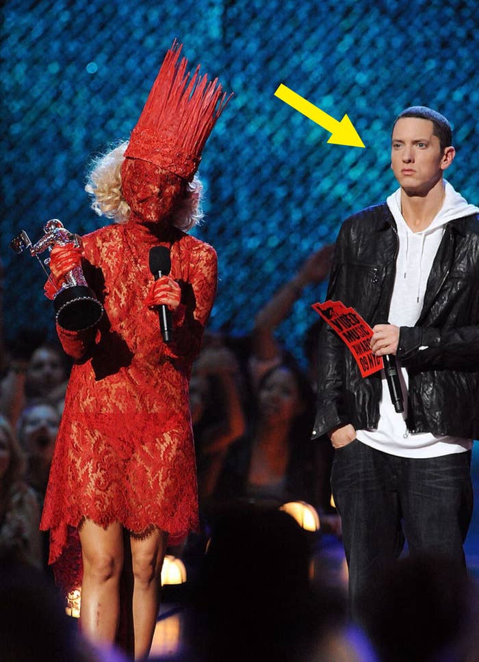 Lady Gaga covered in red lace and Eminem looking confused