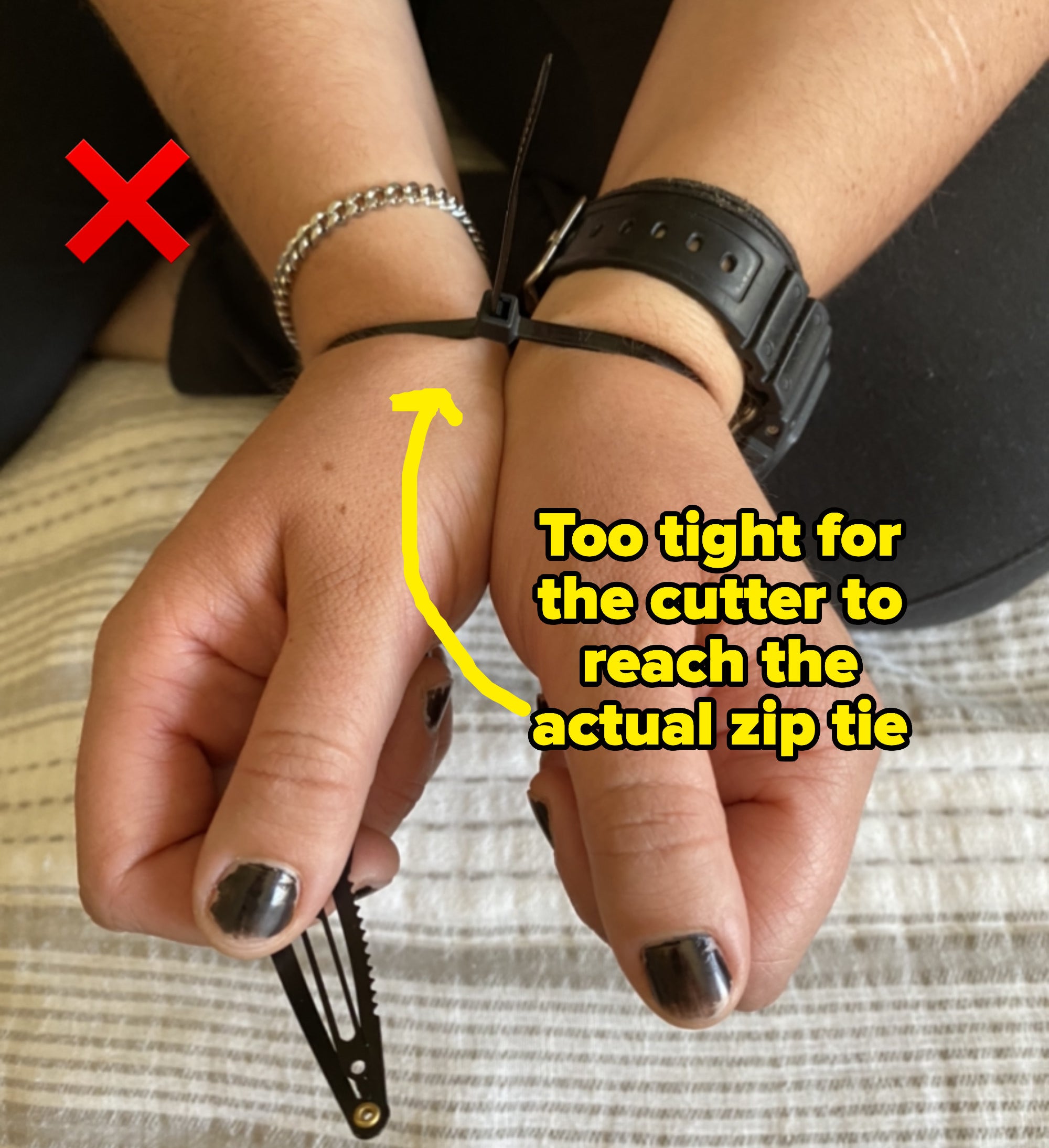 an arrow pointing to the zip ties with text: too tight for the cutter to reach the actual zip tie