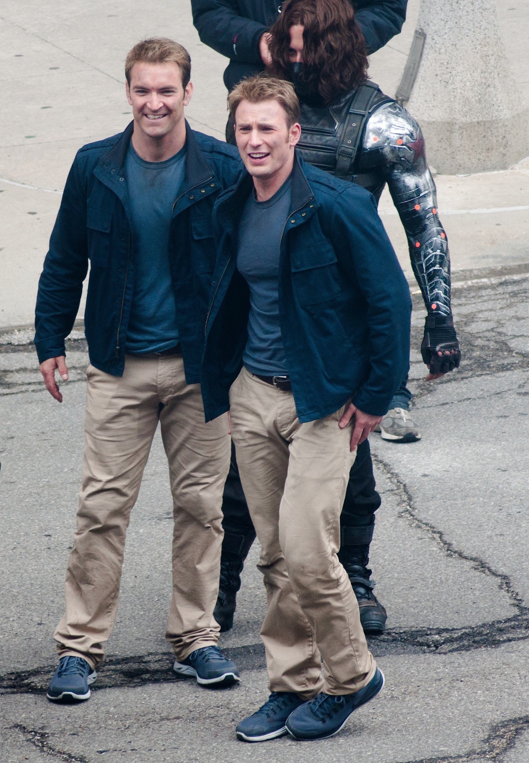 Chris and his body double in matching pants, shirt, jacket, and sneakers