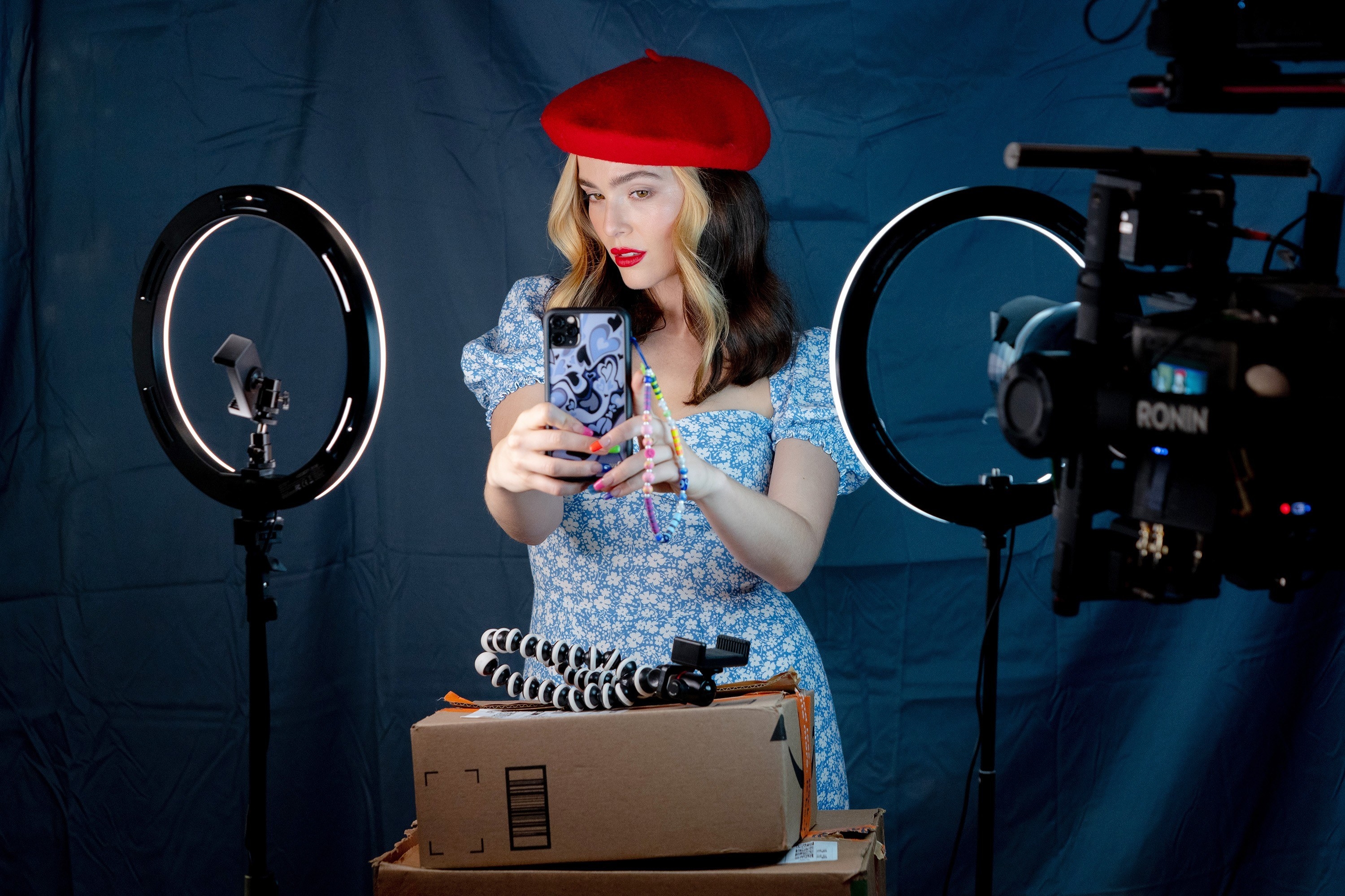 A woman in a beret takes a selfie