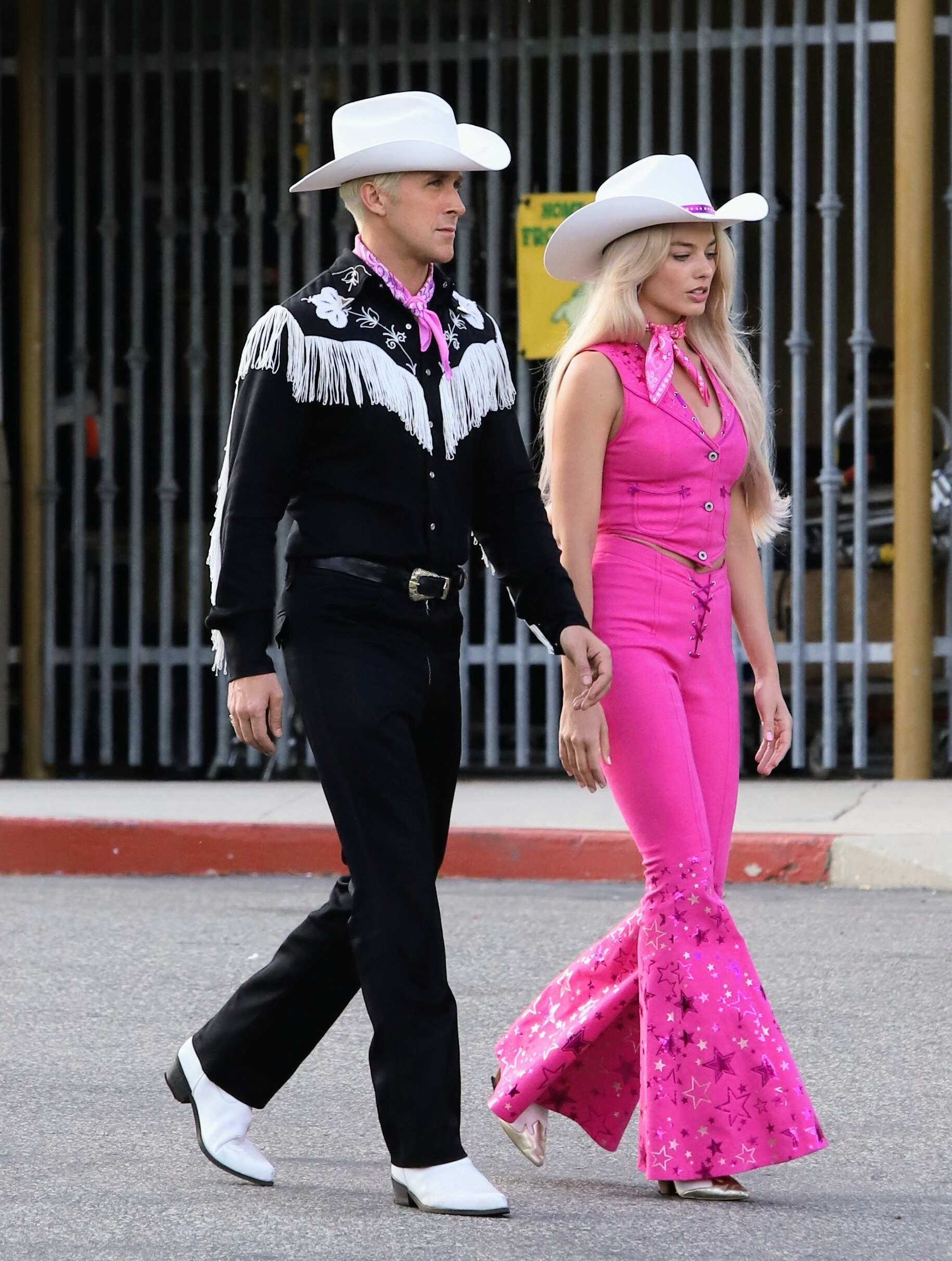 Margot Robbie and Ryan Gosling seen together filming scenes for the new Barbie movie while wearing sexy cowboy costumes