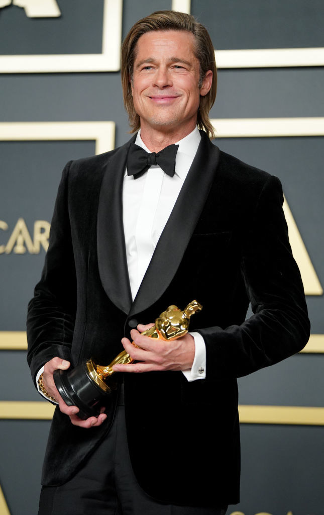 Brad Pitt poses in the press room during the 92nd Annual Academy Awards, holding his Oscar