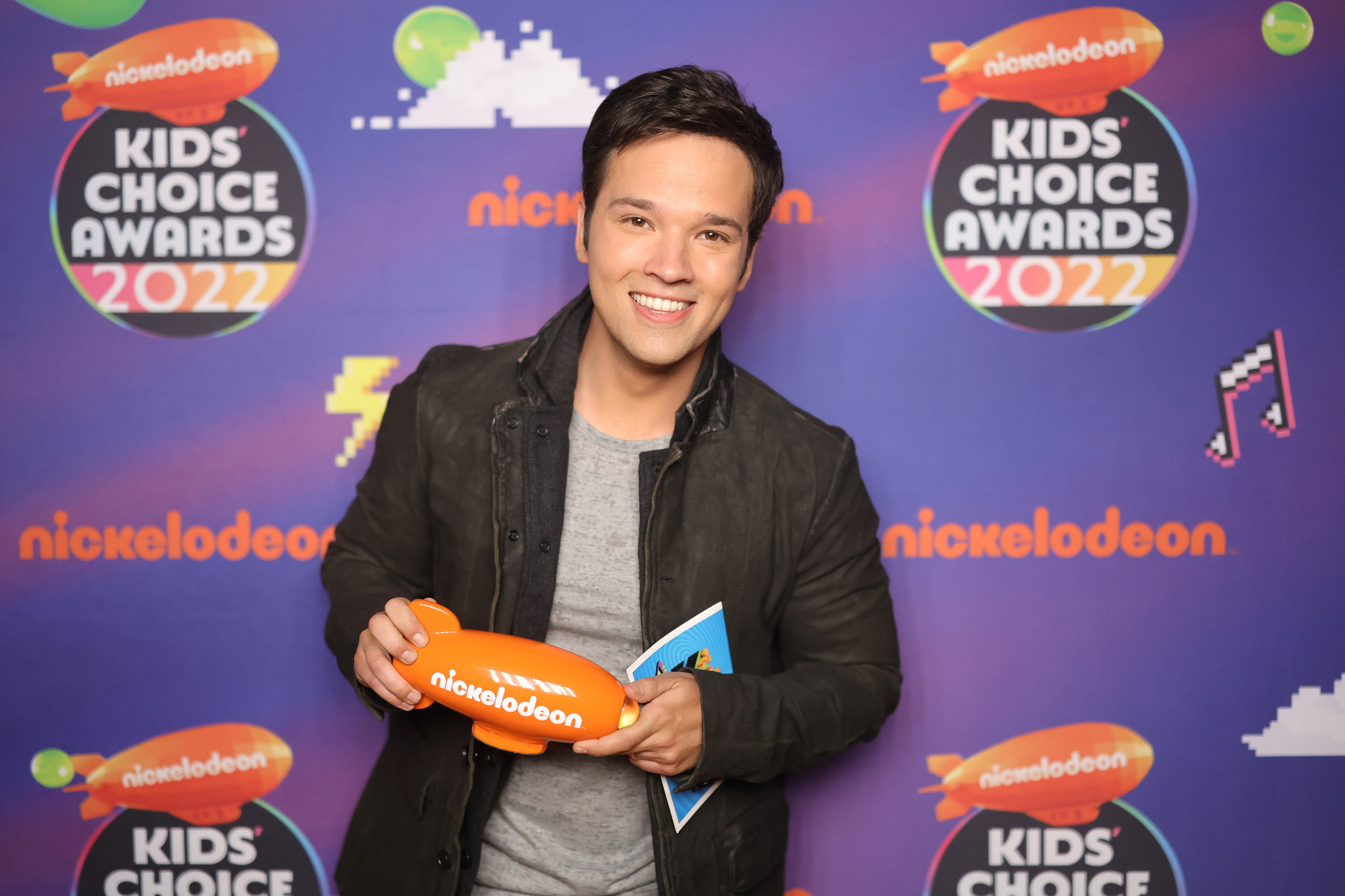 Nathan Kress poses backstage with the award for Favorite Family TV Show at the Nickelodeon&#x27;s Kids&#x27; Choice Awards 2022