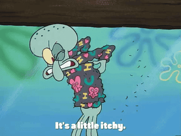 Squidward wearing an itchy sweater