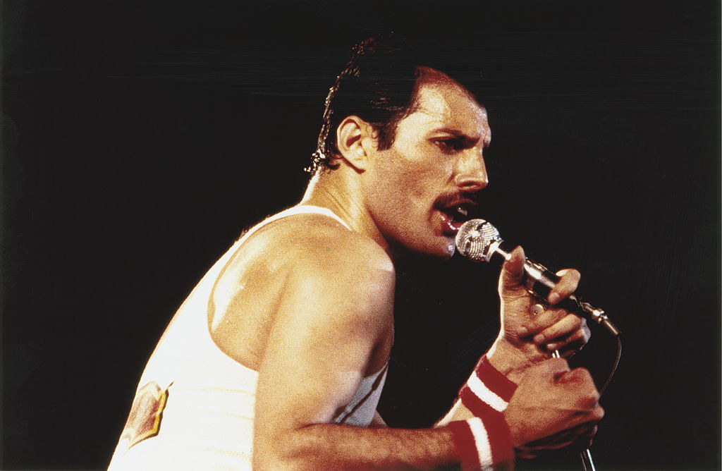 Rock star Freddie Mercury (1946 - 1991) performs with Queen at the Milton Keynes National Bowl, June 1982