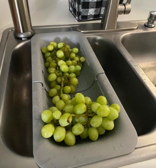 Reviewer image of gray strainer with grapes in it
