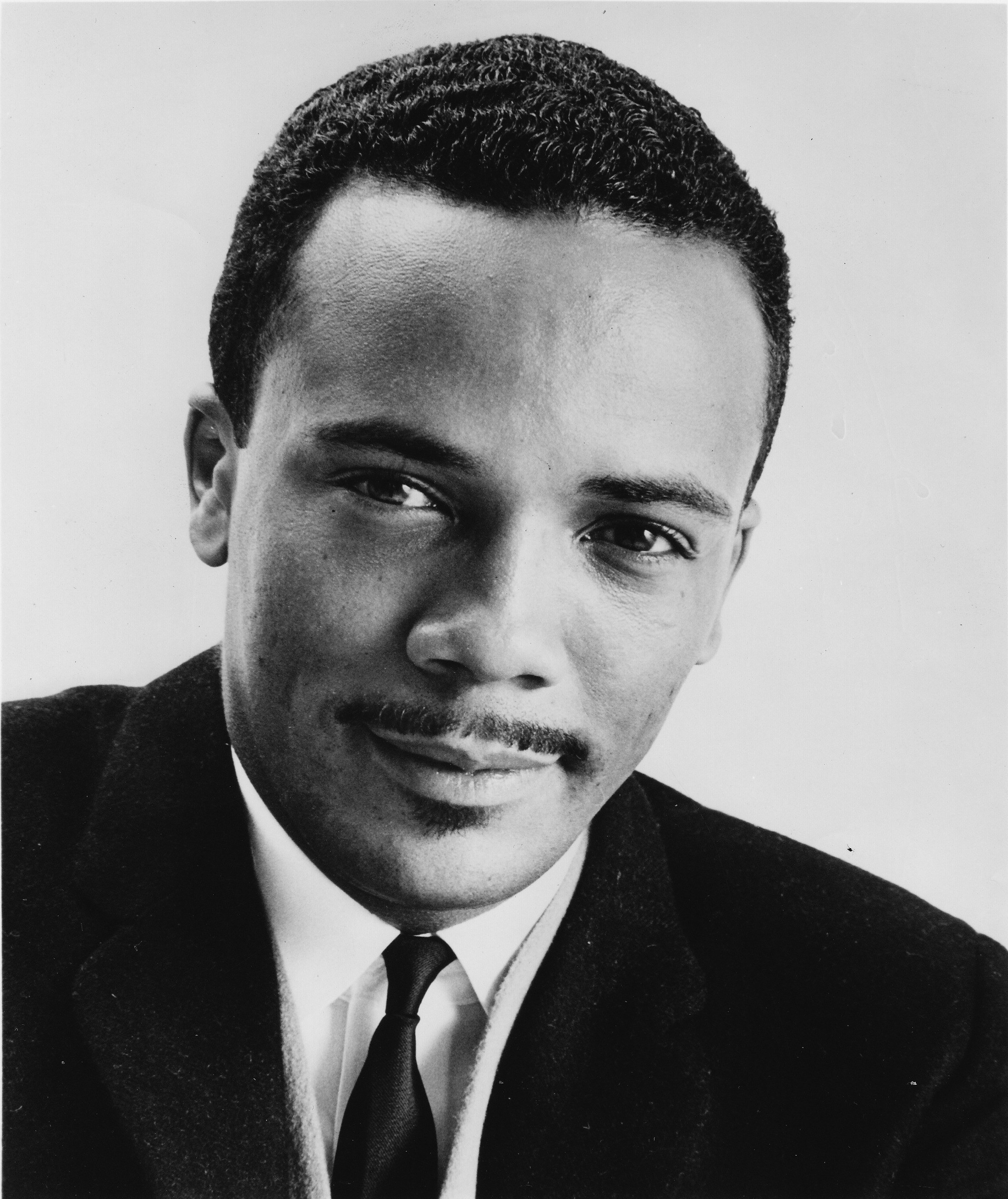 A studio portrait of young Quincy in a suit in 1962