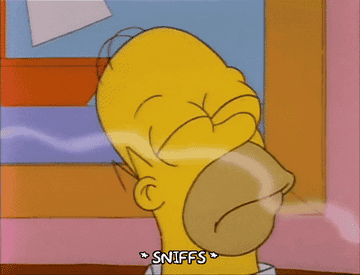 Homer Simpson smelling food in delight