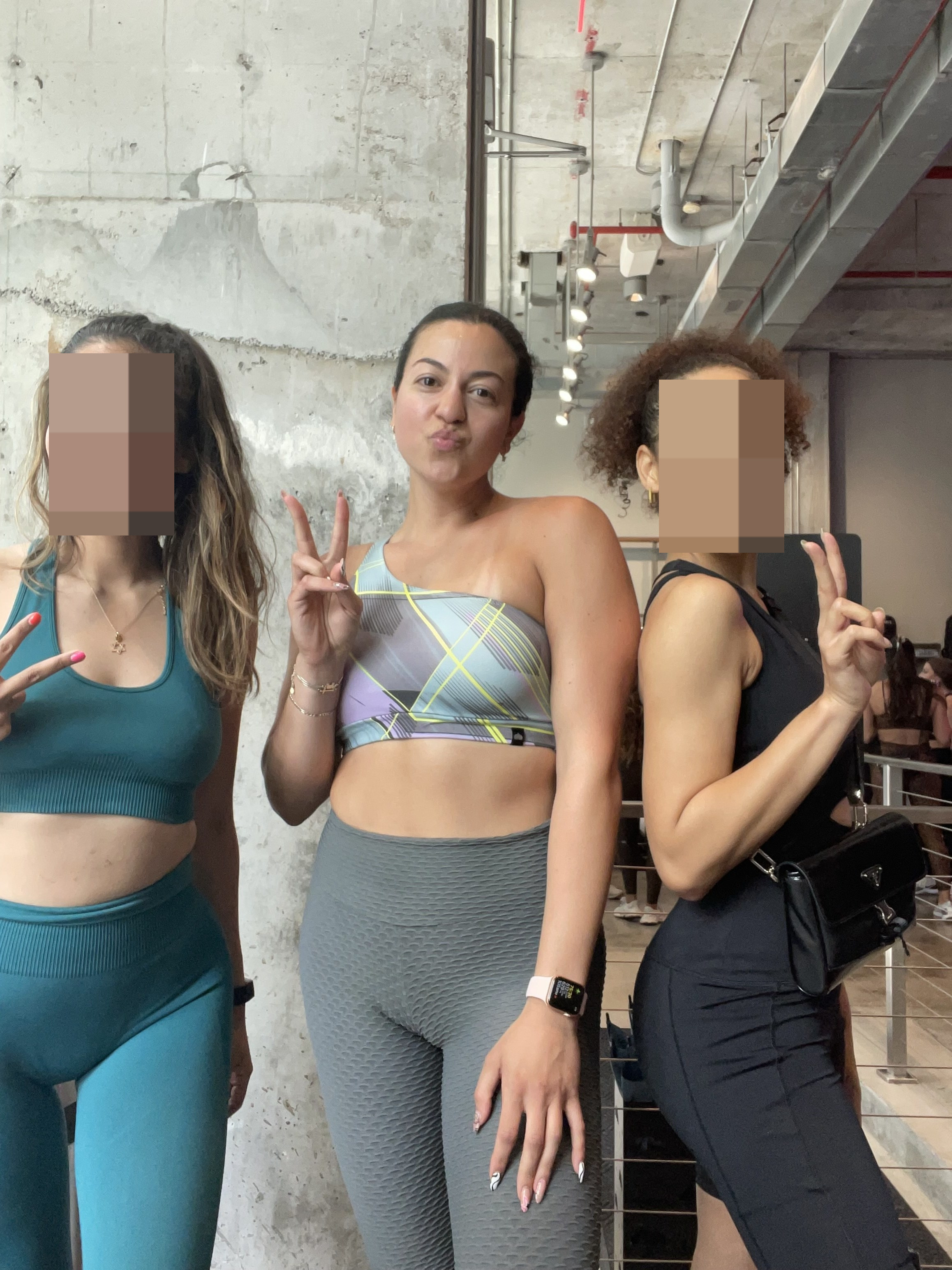 the author posing with two people after a workout class
