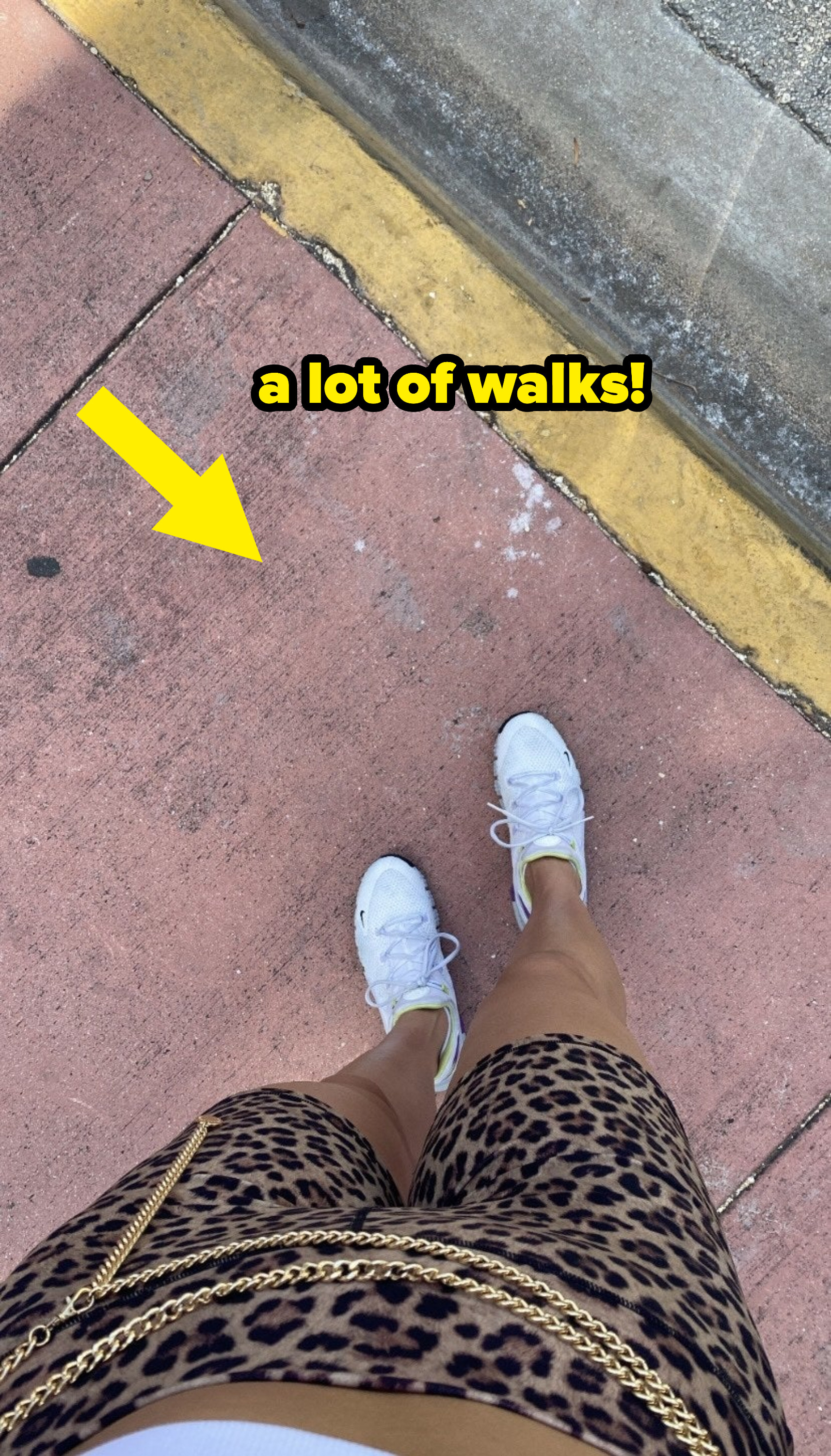 author&#x27;s feet on the sidewalk