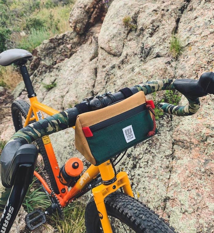 A bike bag on the handlebar of a mountain bik