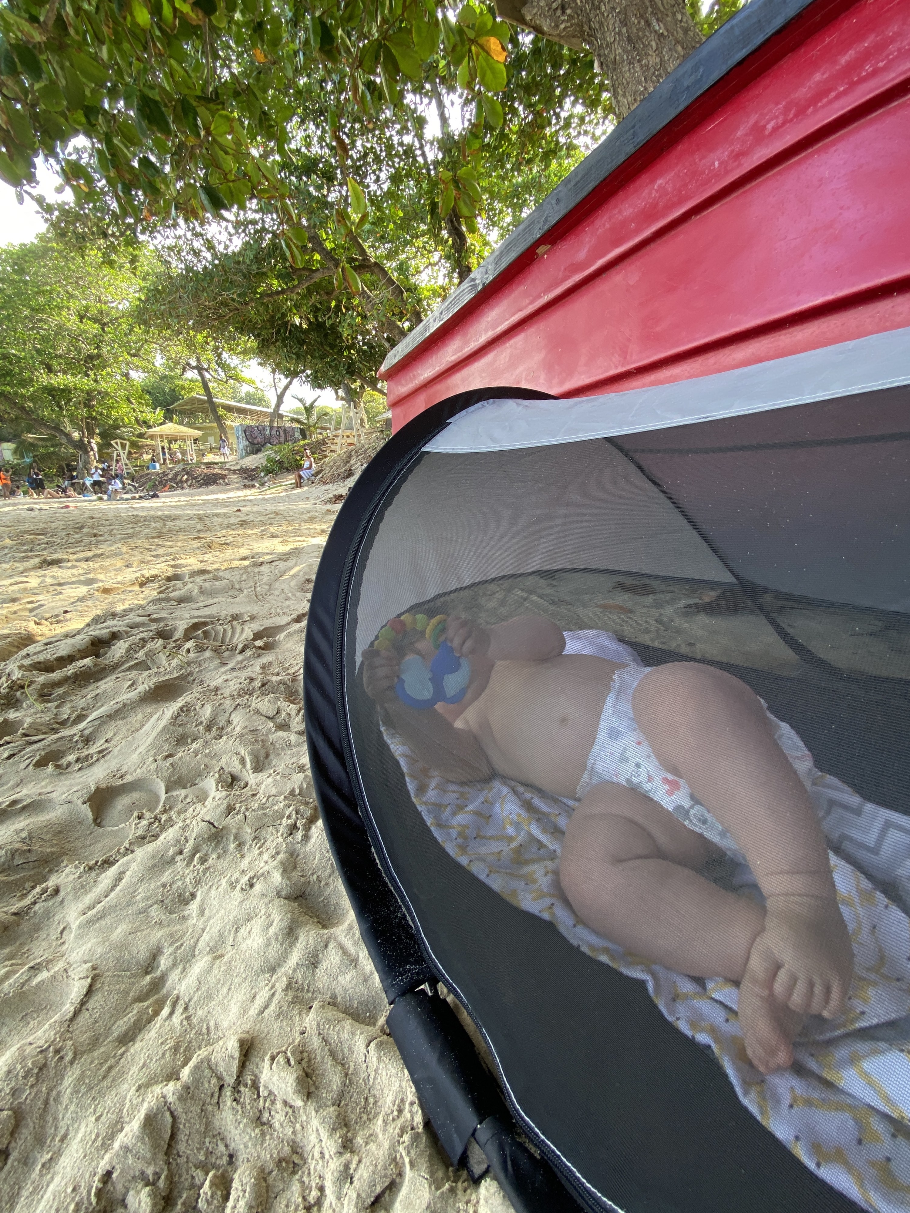 Baby in a beach tent on the sand