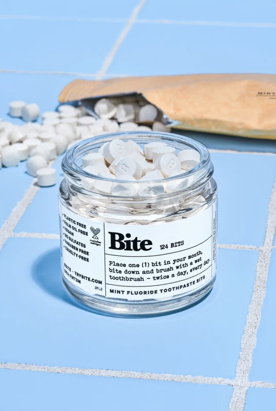 The mint fluoride toothpaste bits in glass jar