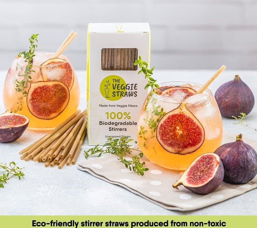 The box of straws next to mixed drinks with caption reading &quot;eco-friendly stirrer straws produced from non-toxic materials that are safe for both you and the environment&quot;