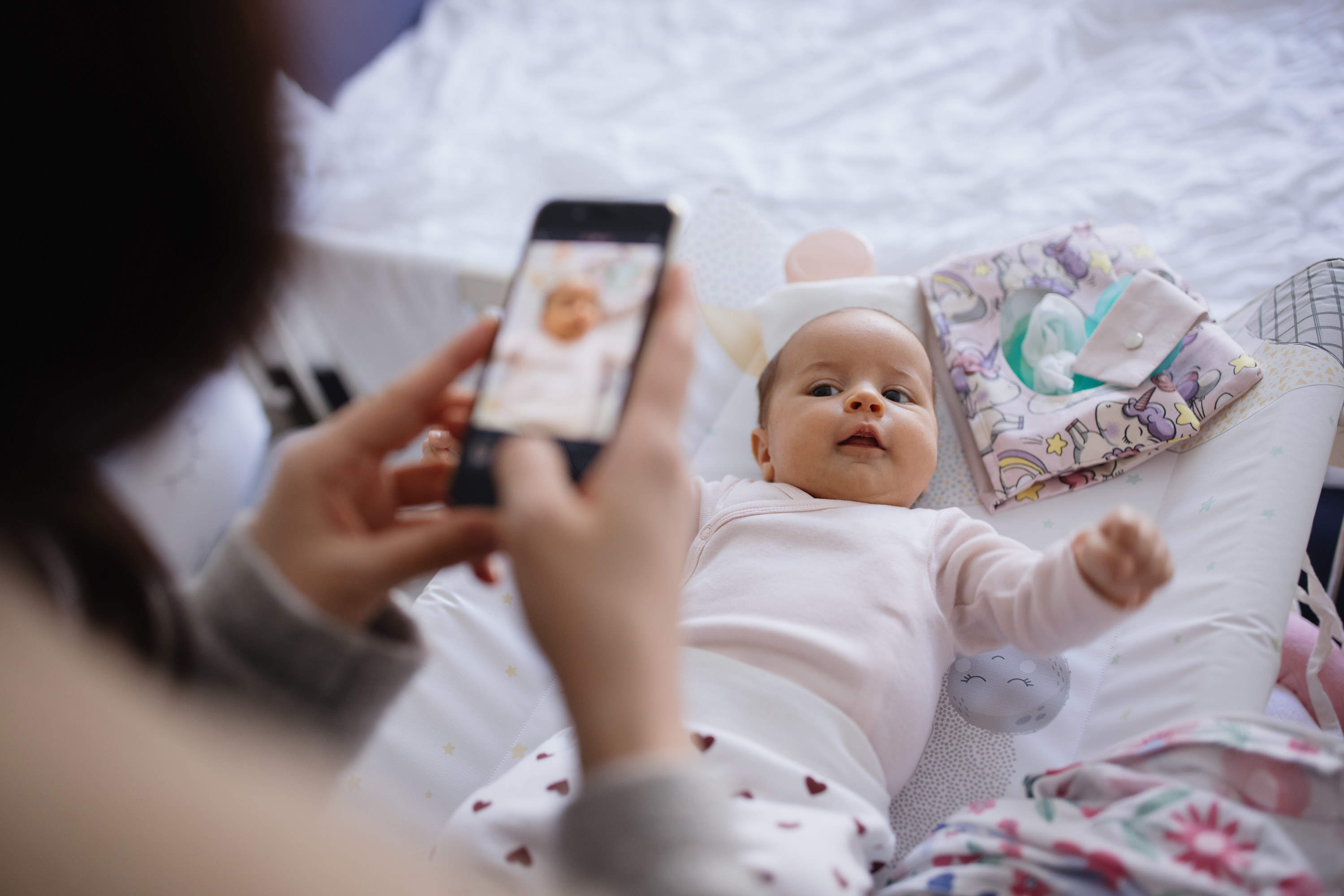 Woman takes photo of baby
