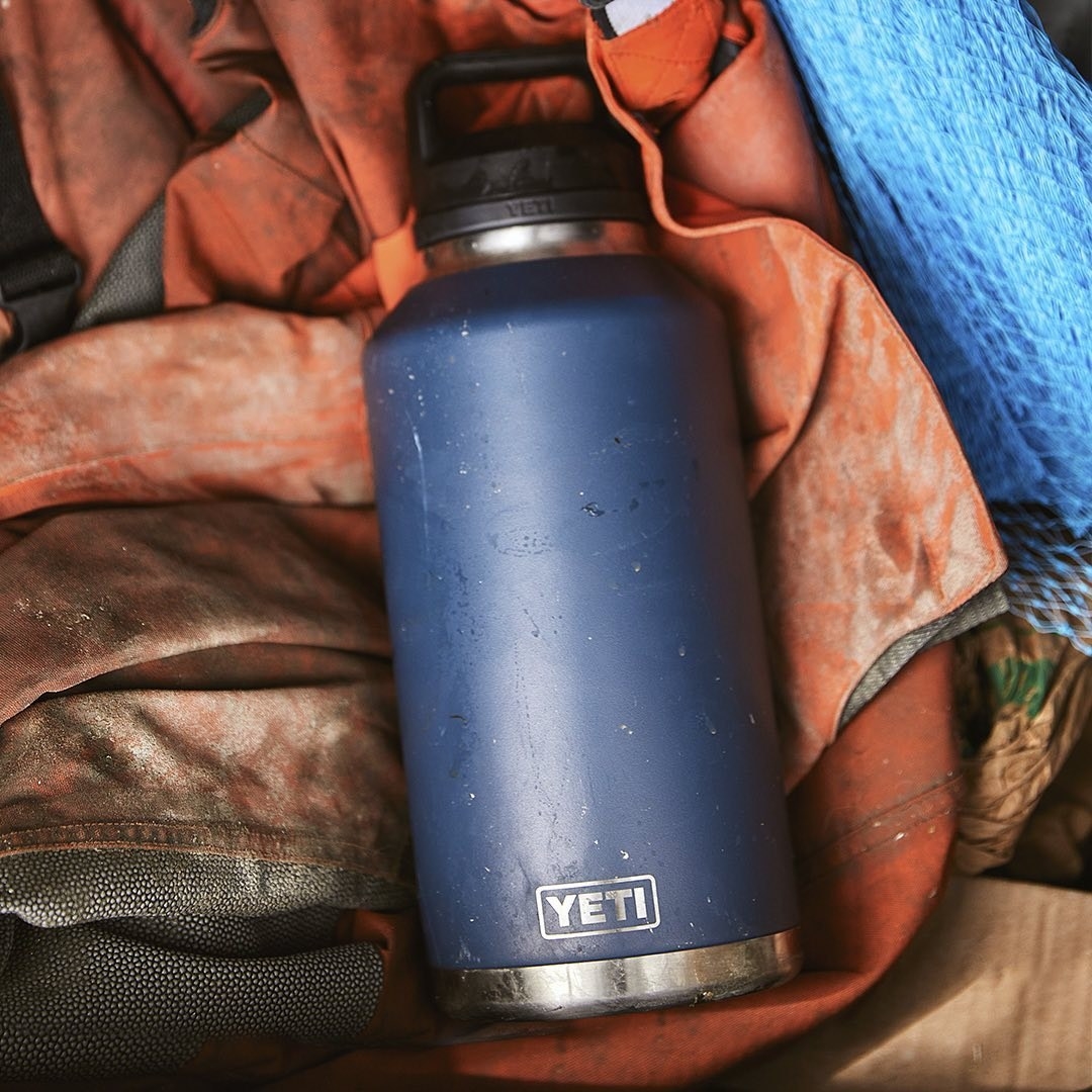 A water bottle on top of camping gear