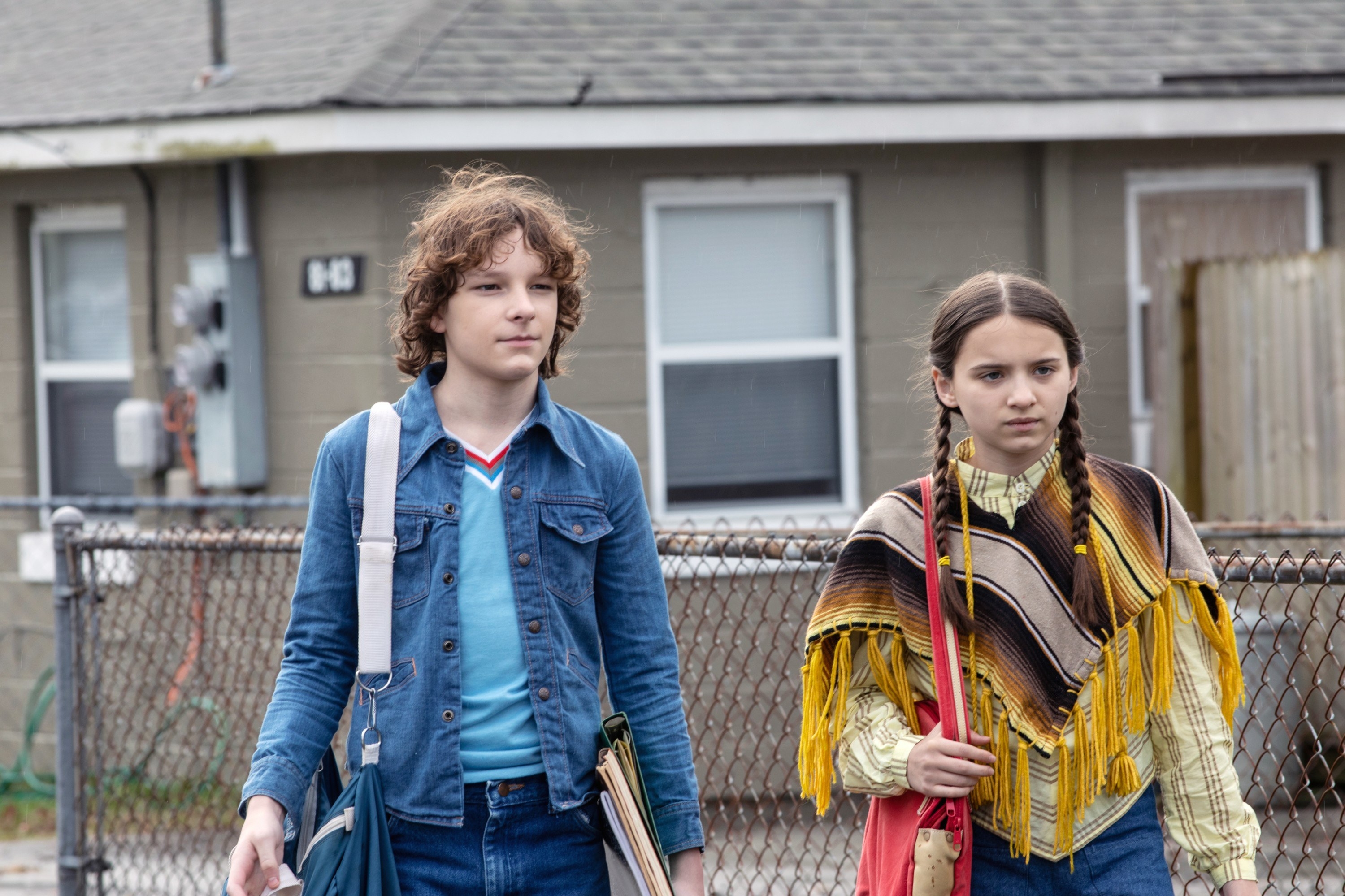 Finney and Gwen standing on the sidewalk together