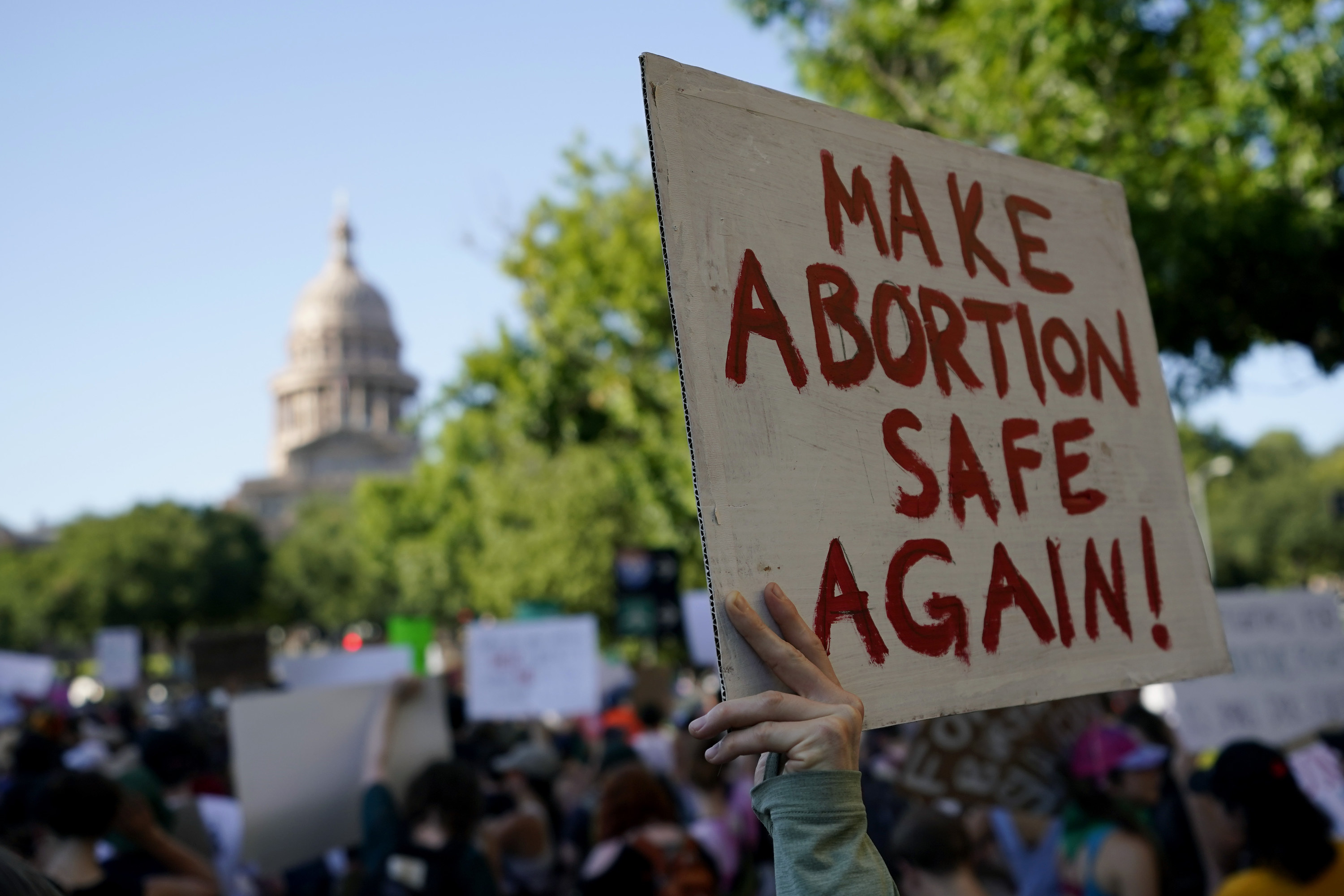 Sign held up: &quot;Make abortion safe again!&quot;