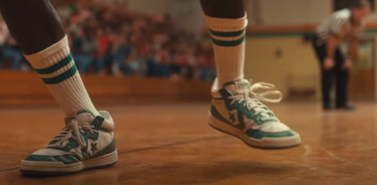 Lucas&#x27;s wearing green and white Converse on the basketball court