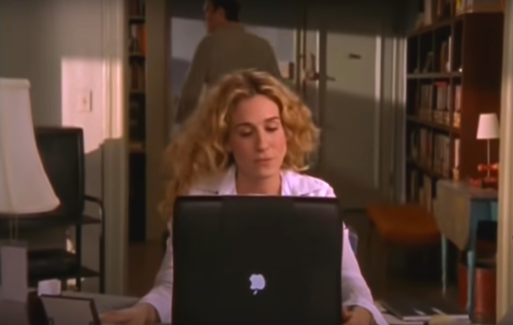 Carrie Bradshaw at her home desk typing away on her computer in &quot;Sex and the City&quot;