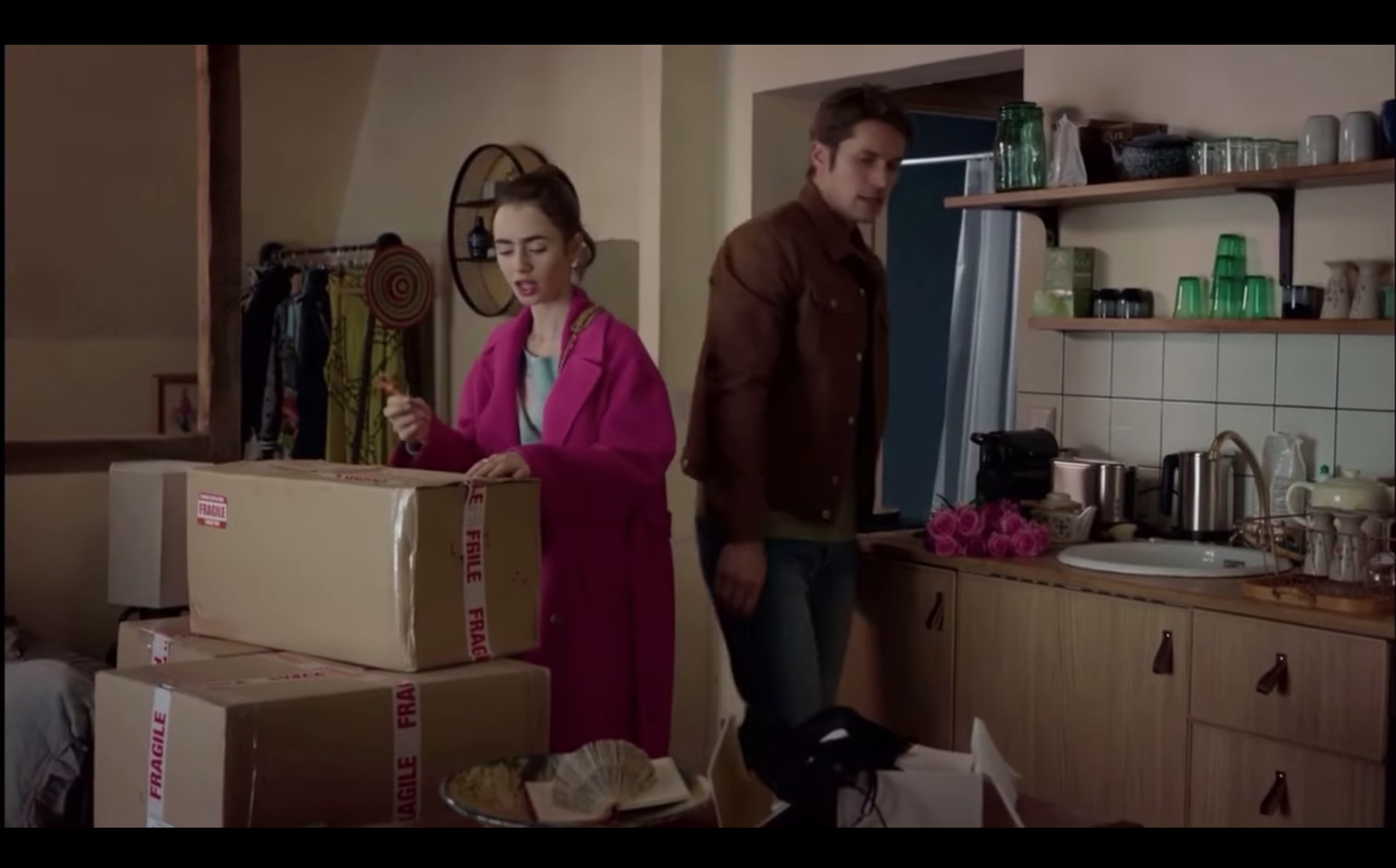 Emily and Gabriel standing in Emily&#x27;s kitchen in &quot;Emily in Paris&quot;