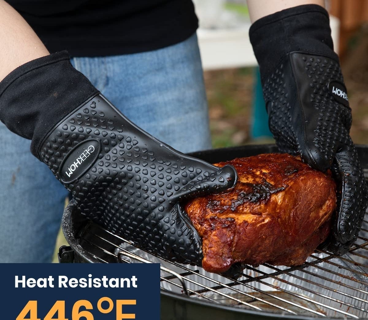 A person wearing the gloves to take a chicken off of a bbq