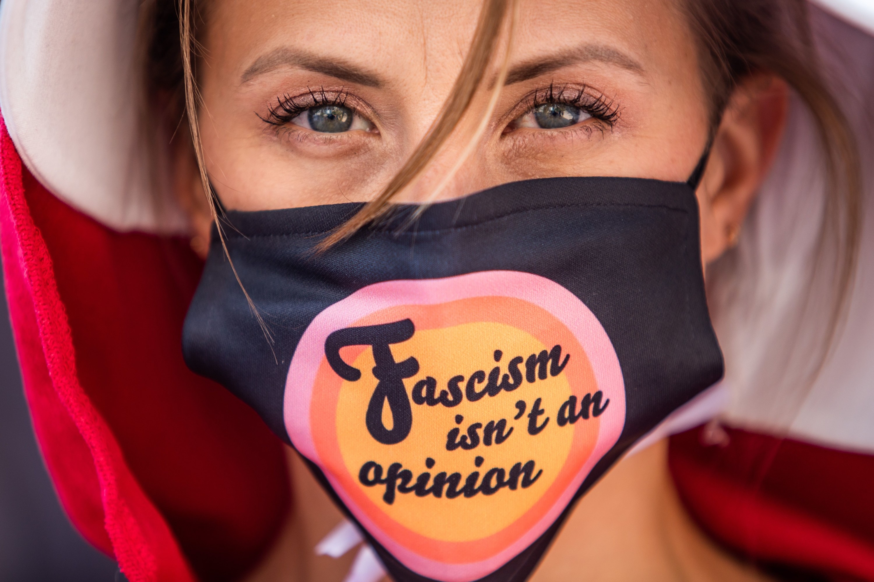 Jodie wearing a mask that says &quot;Fascism isn&#x27;t an opinion&quot;