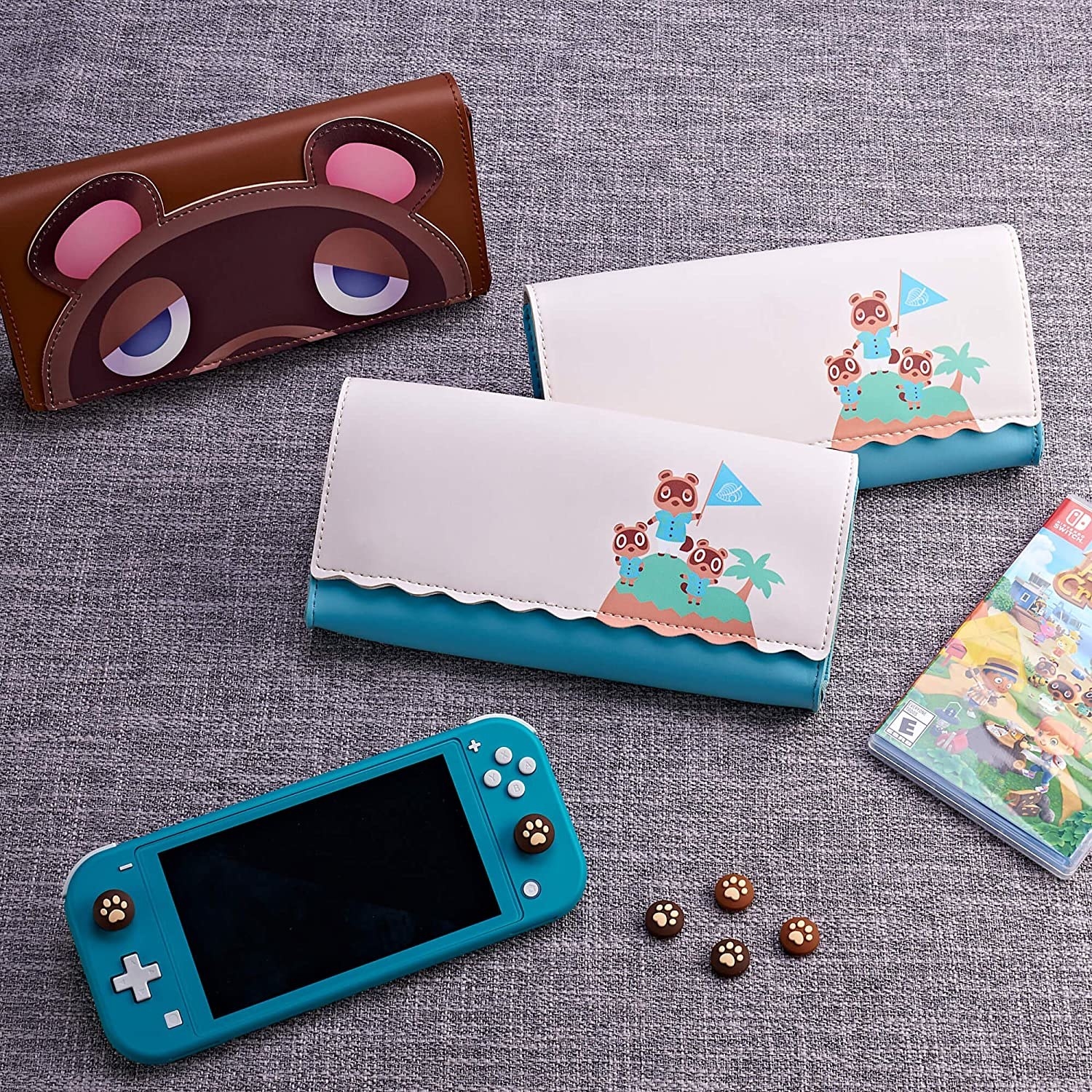 A switch next the different cases with a copy of animal crossing nearby