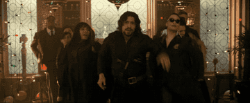 A gif of everyone dancing through the house